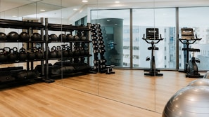 A gym with kettlebells, dumbbells, and exercise equipment. - The Elysian on Margaret at Queen's Wharf (Brisbane City)