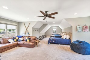 A spacious room with a ceiling fan, a large window, and a view of the outdoors. - McAlister Rd Simply Spectacular (West Union)