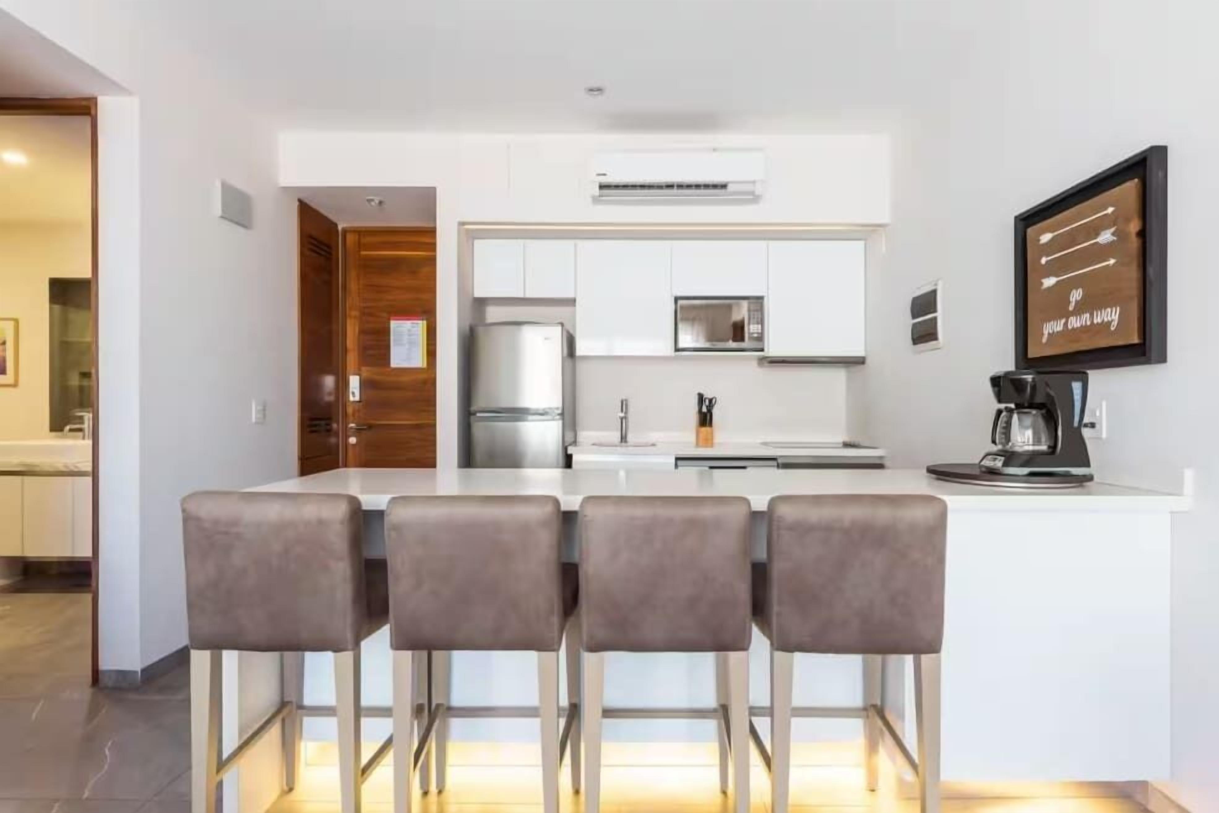 Coffee/tea maker, fridge, microwave, oven