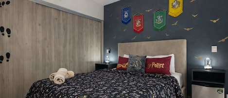 Bright and cozy room filled with natural light, featuring a mini fridge and magical details for a truly enchanting stay.
