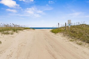 A sandy beach path leading to the ocean with signs indicating beach access rules. - Stella Marina - Hosted by Moore AI Rentals (Fernandina Beach)