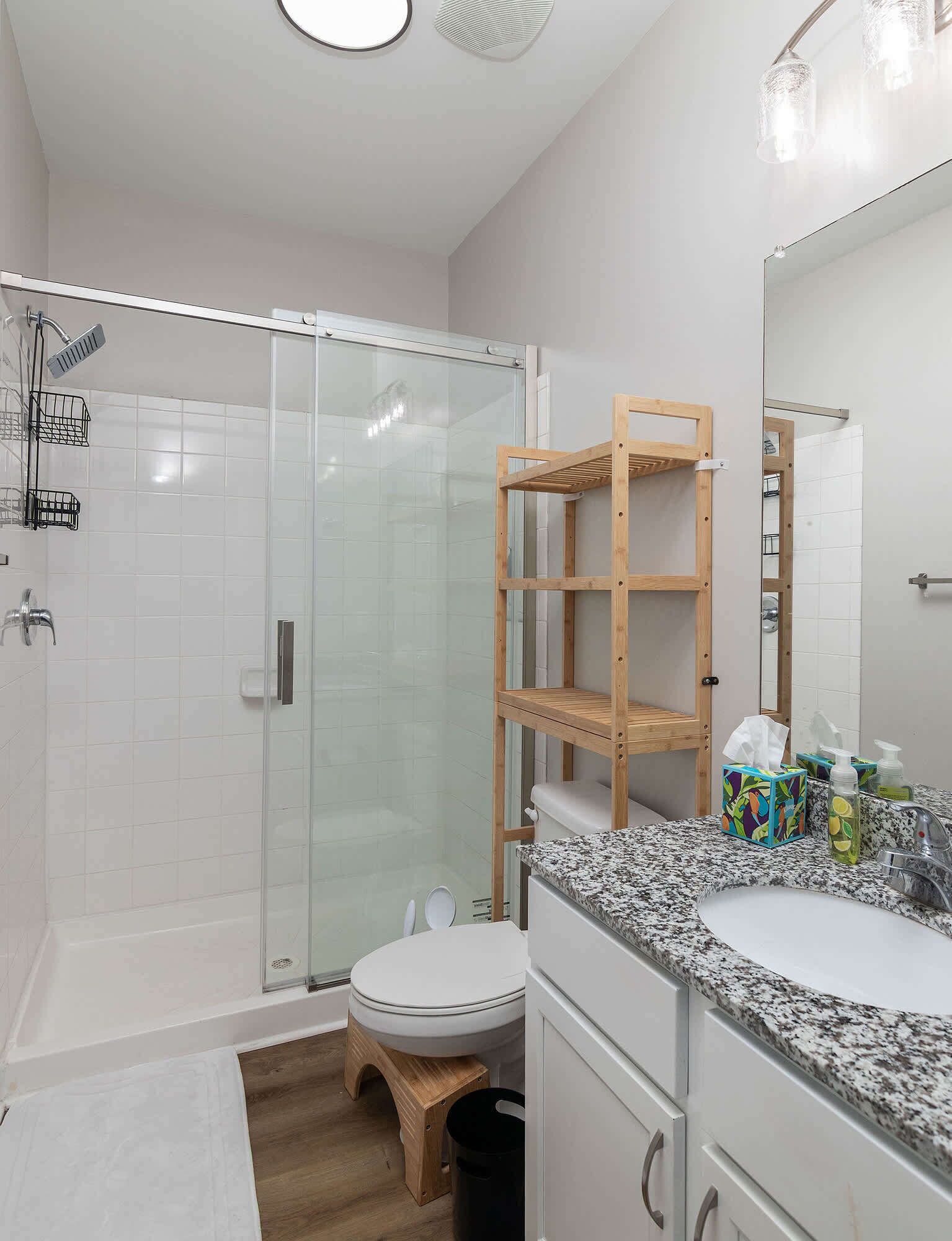 Shower, hair dryer, towels, shampoo