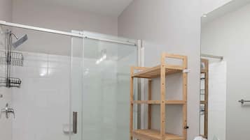 Shower, hair dryer, towels, shampoo