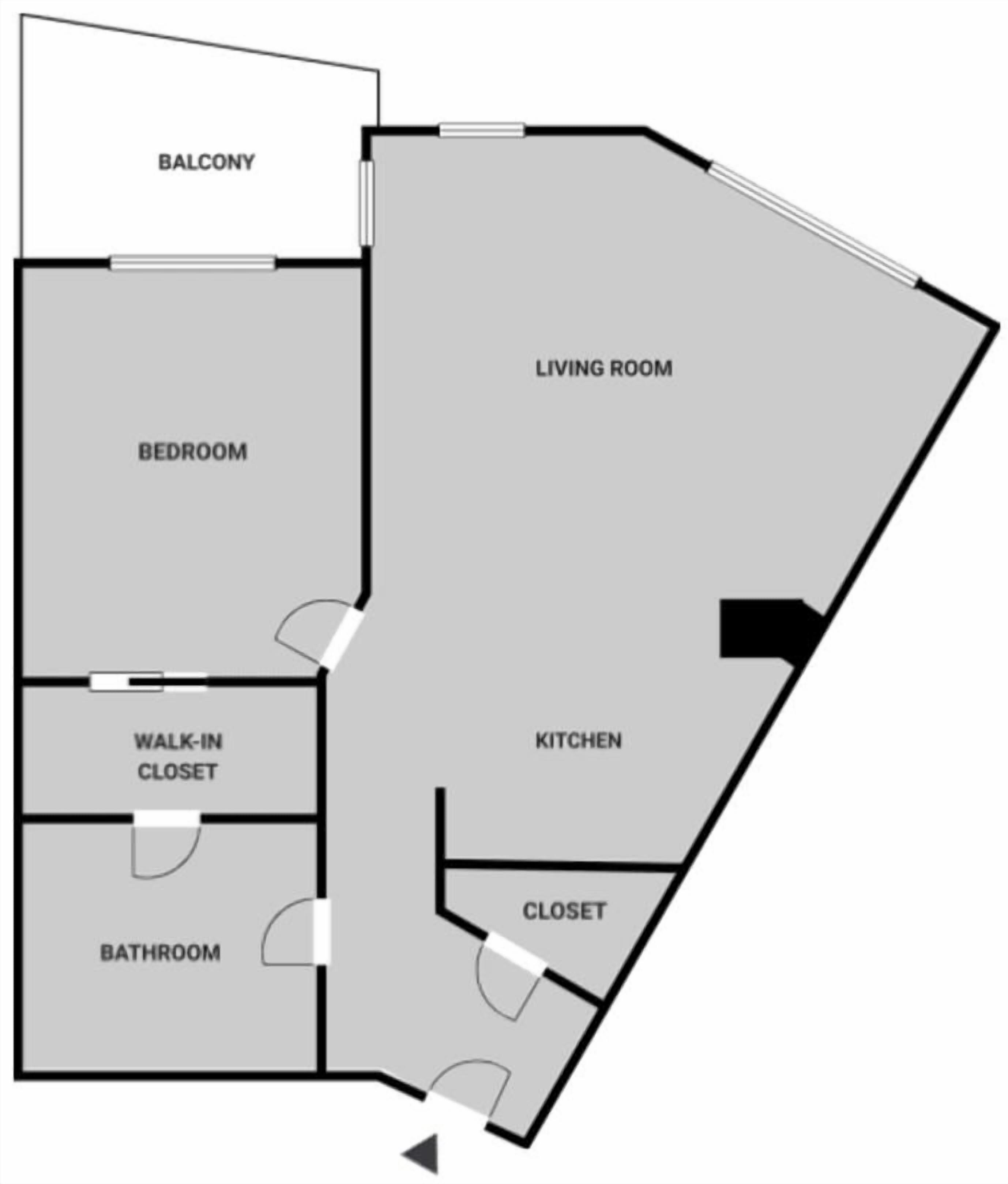 A floor plan with a balcony, bedroom, living room, kitchen, walk-in closet, bathroom, and closet.