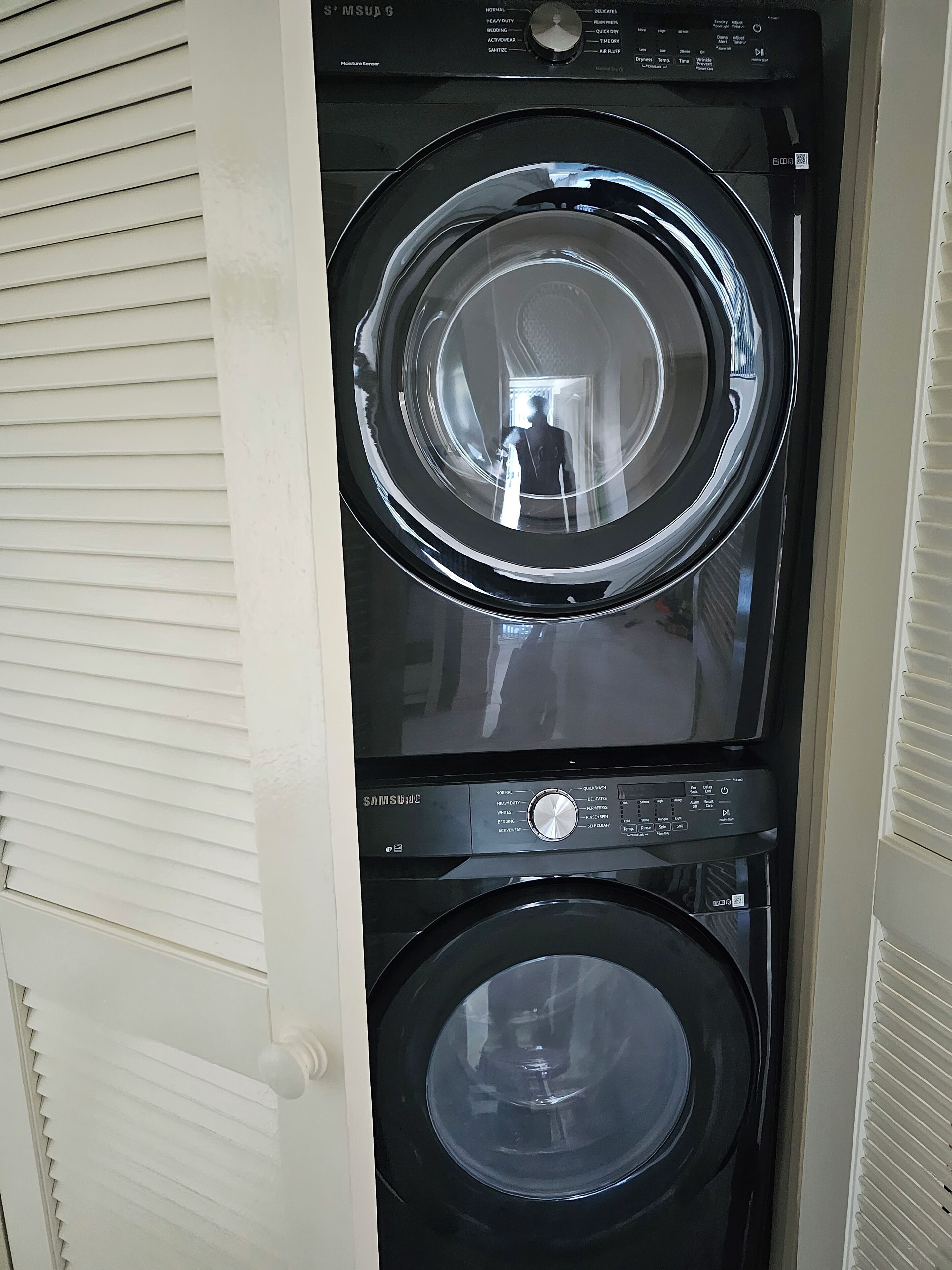 A Samsung front-loading washer and dryer stacked vertically.