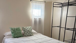 A neatly made bed with a white duvet, two pillows, and a window with sheer curtains. - Welcome to Oakdale, Ca Comfortable Private Bedroom/Bath,
69 miles to Yosemite. (Oakdale)