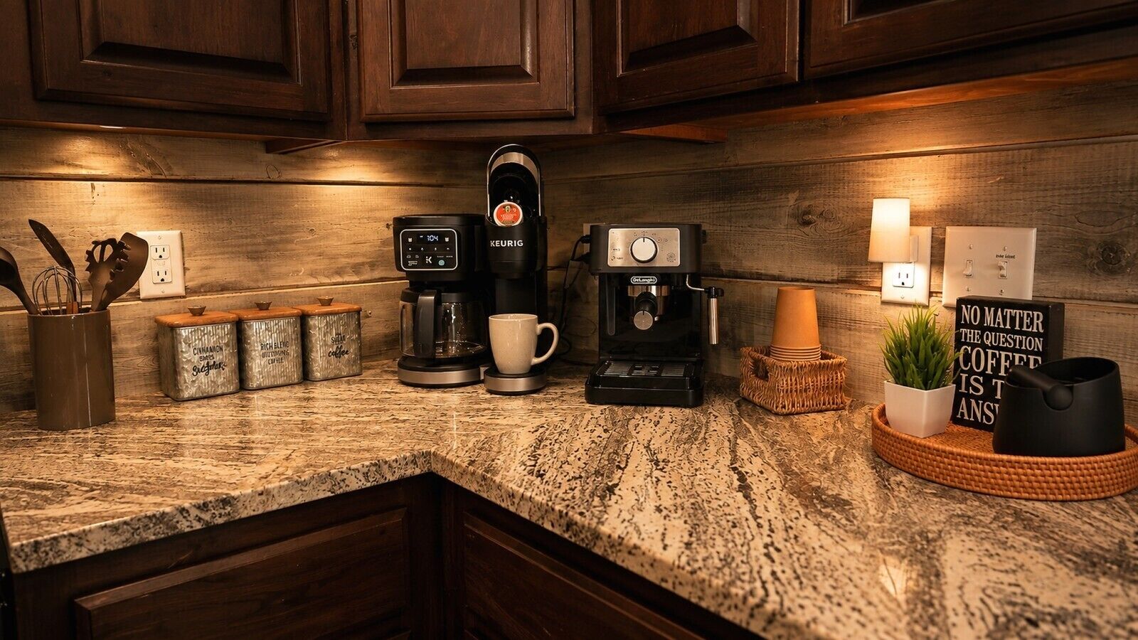 A kitchen counter with a coffee maker, a mug, and a sign that reads 'NO MATTER THE QUESTION COFFEE IS THE ANSWER'.