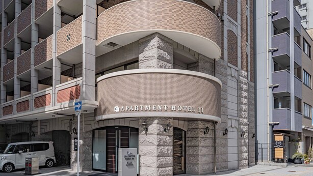 A multi-story building with a prominent 'APARTMENT HOTEL' sign. - Apartment Hotel 11 Kuromon 8 (Osaka-shi)