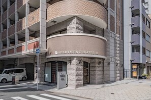 A multi-story building with a prominent 'APARTMENT HOTEL' sign. - Apartment Hotel 11 Kuromon 8 (Osaka-shi)