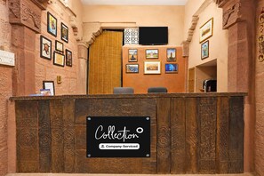 A reception desk with a sign reading 'Collection Company-Serviced'. - Collection O Blue City Jodhpur Formerly (Jodhpur)