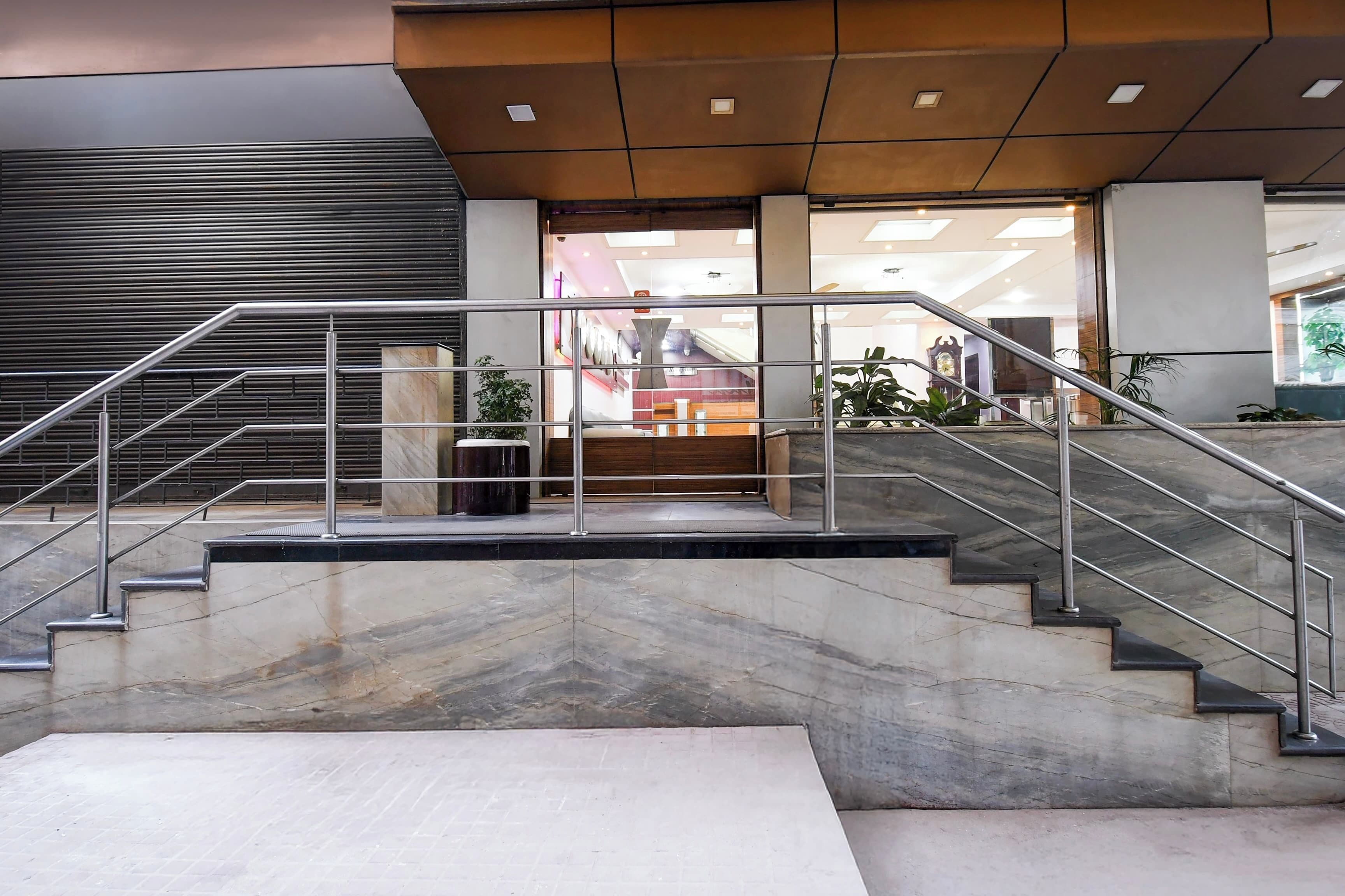 A modern interior with a staircase leading to a reception area.