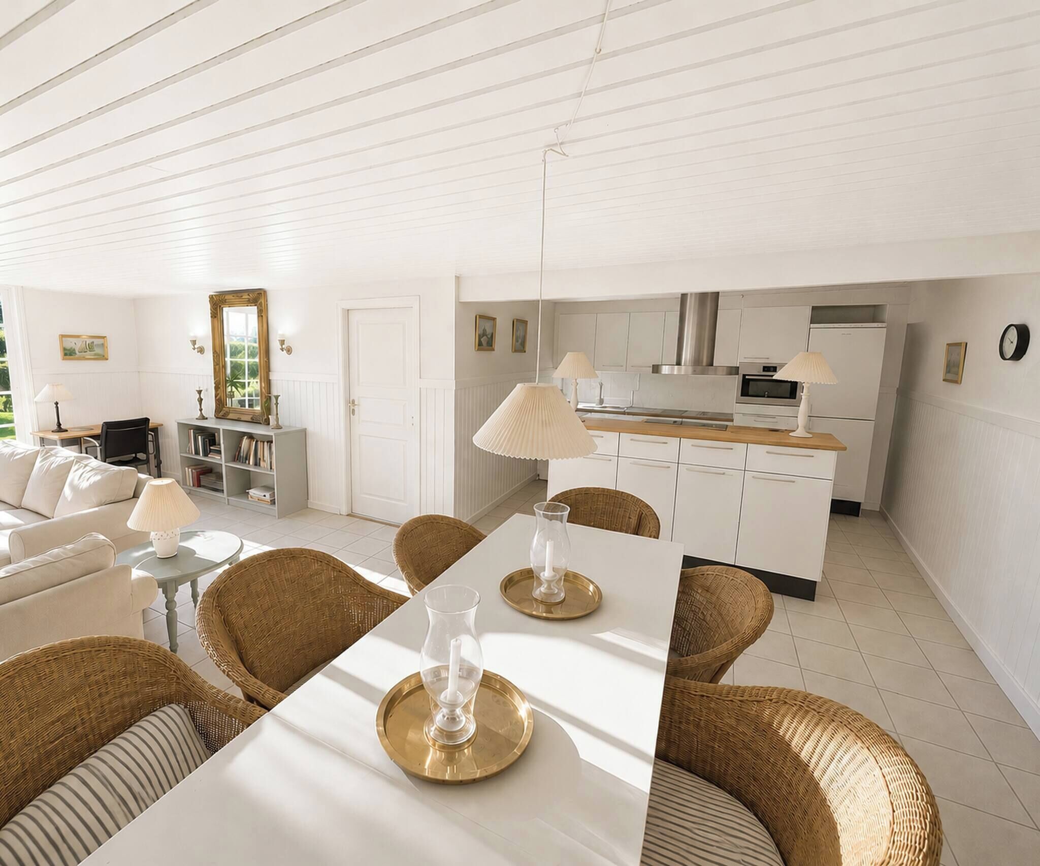 A modern interior with a dining area, kitchen, and living space.