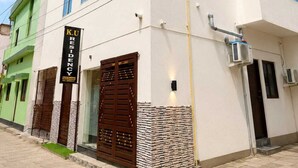 A modern building with a sign reading 'KU RESIDENCY'. - KU Residency (Varanasi)