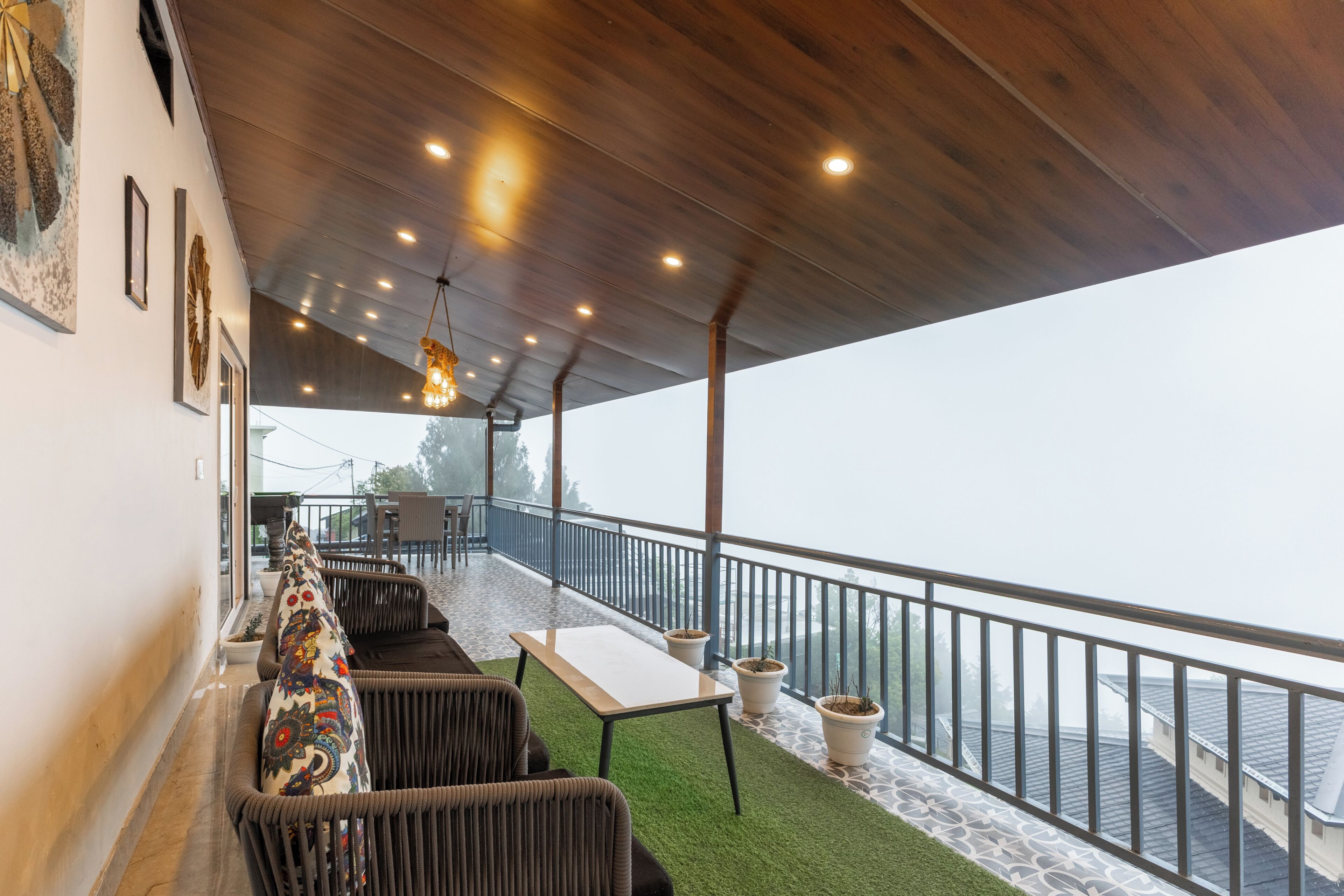 A covered outdoor seating area with a view of the water.