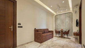 Deluxe Double Room | Living area | Smart TV - Hotel Golden Place 325E (Gurugram)