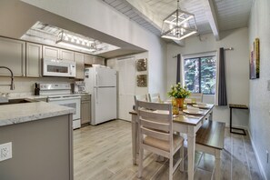 A modern kitchen with white cabinetry, a built-in oven, and a microwave. - Great for Families! Pinetop Sanctuary w/ Patio (Pinetop)