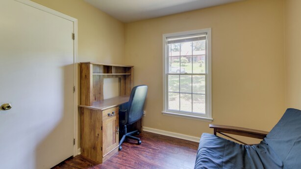 A room with a wooden desk, a chair, a window, and a door. - Columbus Home Near Parks, Shops & Dining (Columbus)