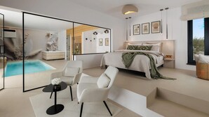 A modern bedroom with a large bed, a bedside table, a nightstand, a window with a view, and a bathroom with a bathtub. - Stunning home in Zupanici with sauna (Zupanici)