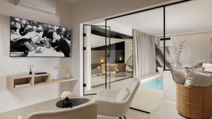 A modern living room with a television, a pool, and a glass door leading to an outdoor seating area. - Stunning home in Zupanici with sauna (Zupanici)
