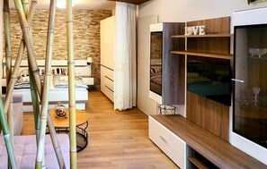 A modern bedroom with a bed, bedside tables, and a wardrobe. - Awesome apartment in Dramalj with WiFi (Dramalj)