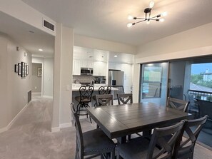 A modern kitchen with white cabinets, a stainless steel microwave, and a built-in oven. - Cozy 3-bedroom condo with AC in awesome Cave Creek AZ (Cave Creek)