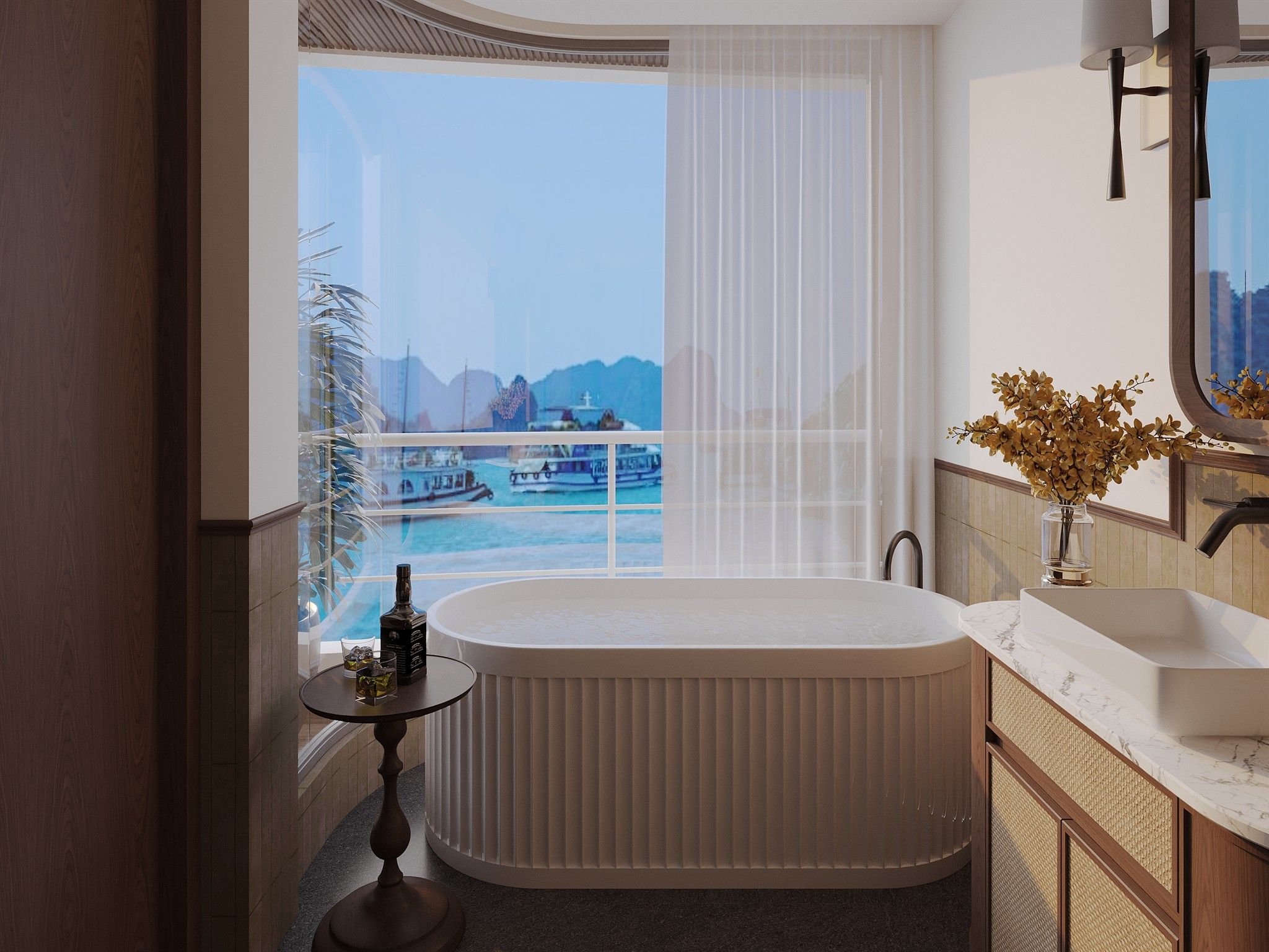 A modern bathroom with a freestanding bathtub, a large window with a view of boats and mountains, a round table with a bottle and glass, and a vanity with a mirror and vase.