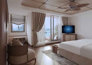 A hotel room with a bed, a television, a window with curtains, a chair, and a view of the sea. - Harmony Boutique Cruise (Tuan Chau)