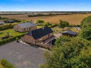 A rural property with a main house, a smaller attached building, and a barn. - "Meindor" - 450m to the fjord by Interhome (Ulfborg)