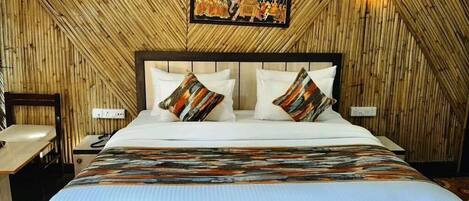 A room with a bed, a nightstand, and a wall-mounted picture.