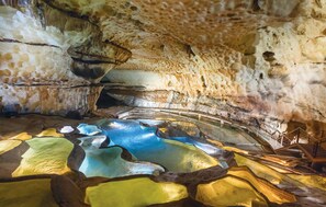 A cave interior with a natural pool and stalactites. - Amazing home in Salazac (Salazac)