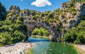 A natural rock arch formation with a beach and boats. - Amazing home in Salazac (Salazac)