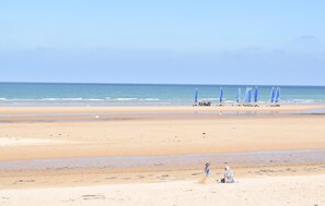 A beach with a sandy shore and a calm sea. - Close to D-Day beaches (Isigny-sur-Mer)