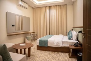 In-room safe, desk, laptop workspace, blackout drapes - Alan serviced apartments (Hail)