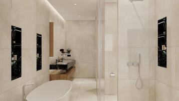 Un baño moderno con una bañera independiente, ducha con mampara de vidrio y un tocador con espejo.
