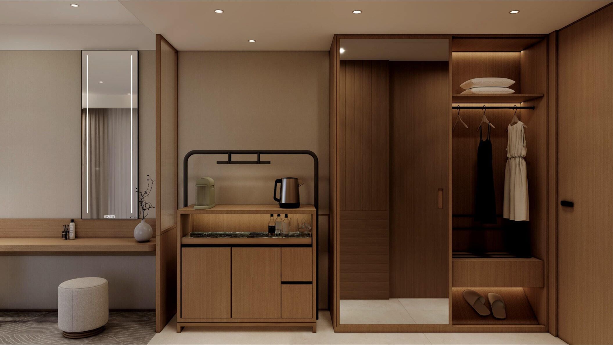 Un baño moderno con tocador, espejo y un vestidor con ropa y zapatos colgados.