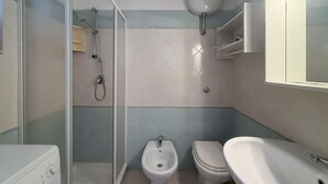 A bathroom with a shower, bidet, toilet, and sink. - Stunning home in Costa Rei with WiFi (Costa Rei)