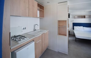 A compact kitchenette with a gas stove, sink, and a white refrigerator. - Awesome home in Torino di Sangro with WiFi (Torino di Sangro)