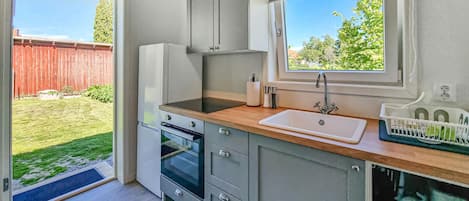 Fridge, microwave, cookware/dishes/utensils