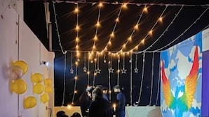 An indoor event space with a stage, seating area, and decorative lights. - Heistel Delhi (New Delhi)