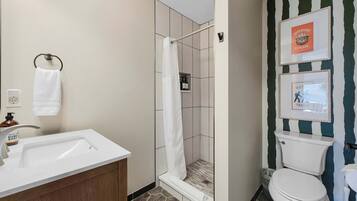 Shower, hair dryer, towels, shampoo