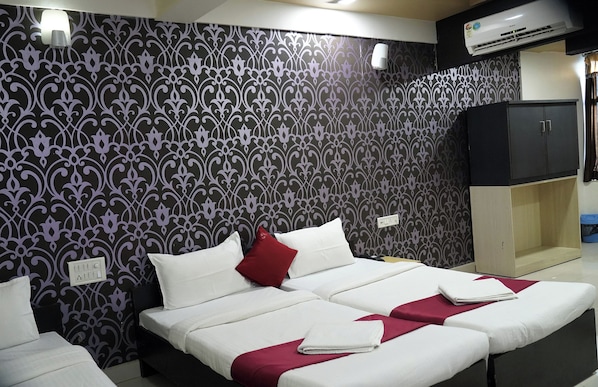 Royal Triple Room | Premium bedding, memory foam beds, bed sheets - Hotel Sukh Sagar (Veraval)