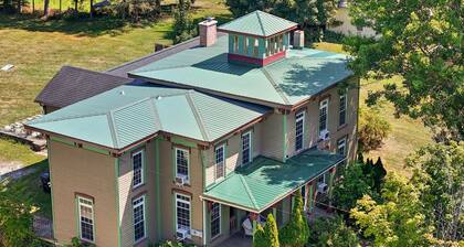 Historic charm meets modern comfort in this pet-friendly retreat for 10, with 3 king bedrooms, 2 queens, a heated indoor pool, hot tub, and TV & A/C in every bedroom.