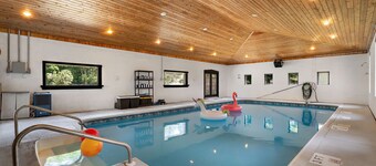 Year-round fun awaits! This pet-friendly retreat sleeps 10 and features 3 king bedrooms, a room with two queens, a heated indoor pool, saltwater hot tub, and TVs with A/C in every bedroom.