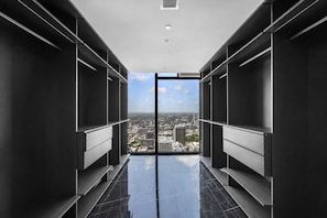 A modern elevator shaft with a city view, featuring a reflective floor and minimalist design. - Executive Miami Penthouse - 2bdr (Miami)