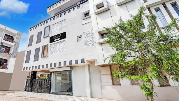 A modern building with a sign reading 'Collection'. - Collection O Iskcon Temple Mansarovar  (Jaipur)