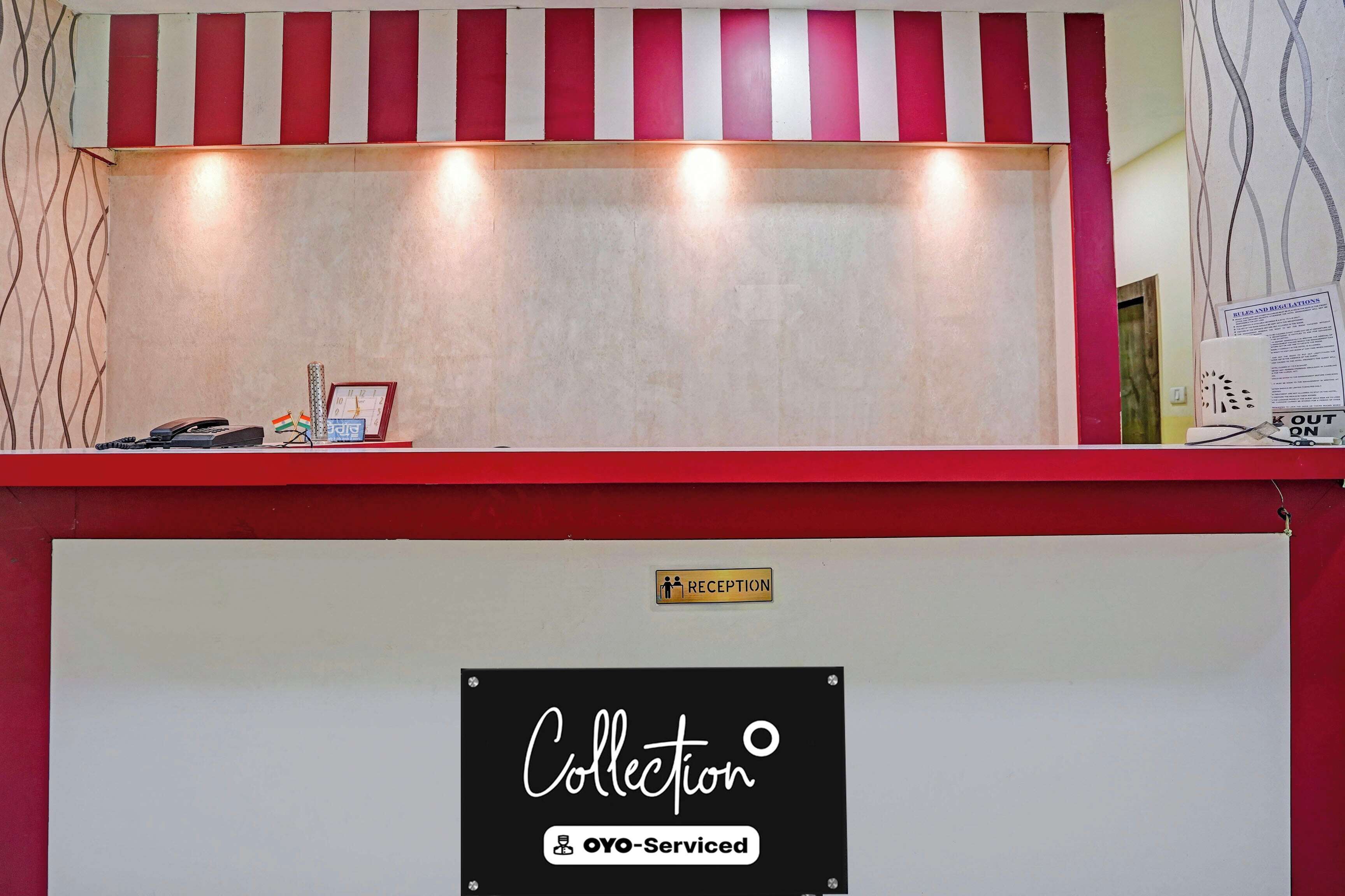 A reception desk with a sign indicating a collection service and a reception area.