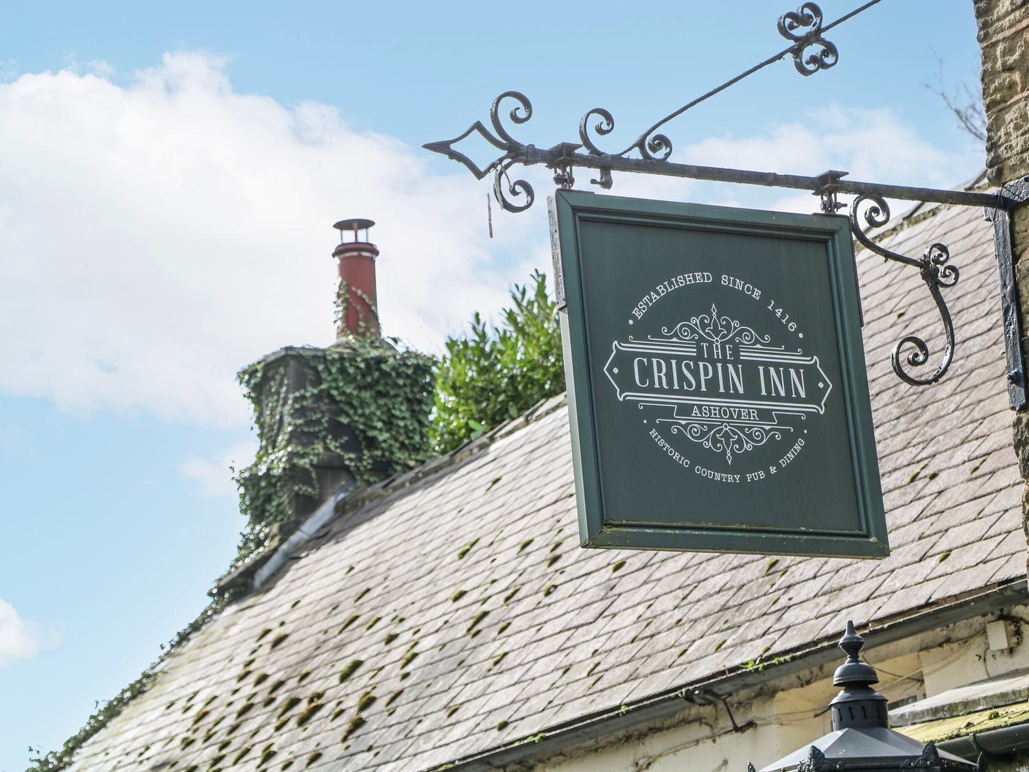 A sign for The Crispin Inn, established since 1846, with a historic country pub and dining.