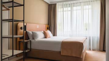 Desk, laptop workspace, blackout curtains, free WiFi