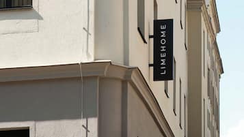 A building with a sign that reads 'LIMEHOME' on the side.