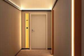 A hallway with a door labeled '207' and a keycard reader.